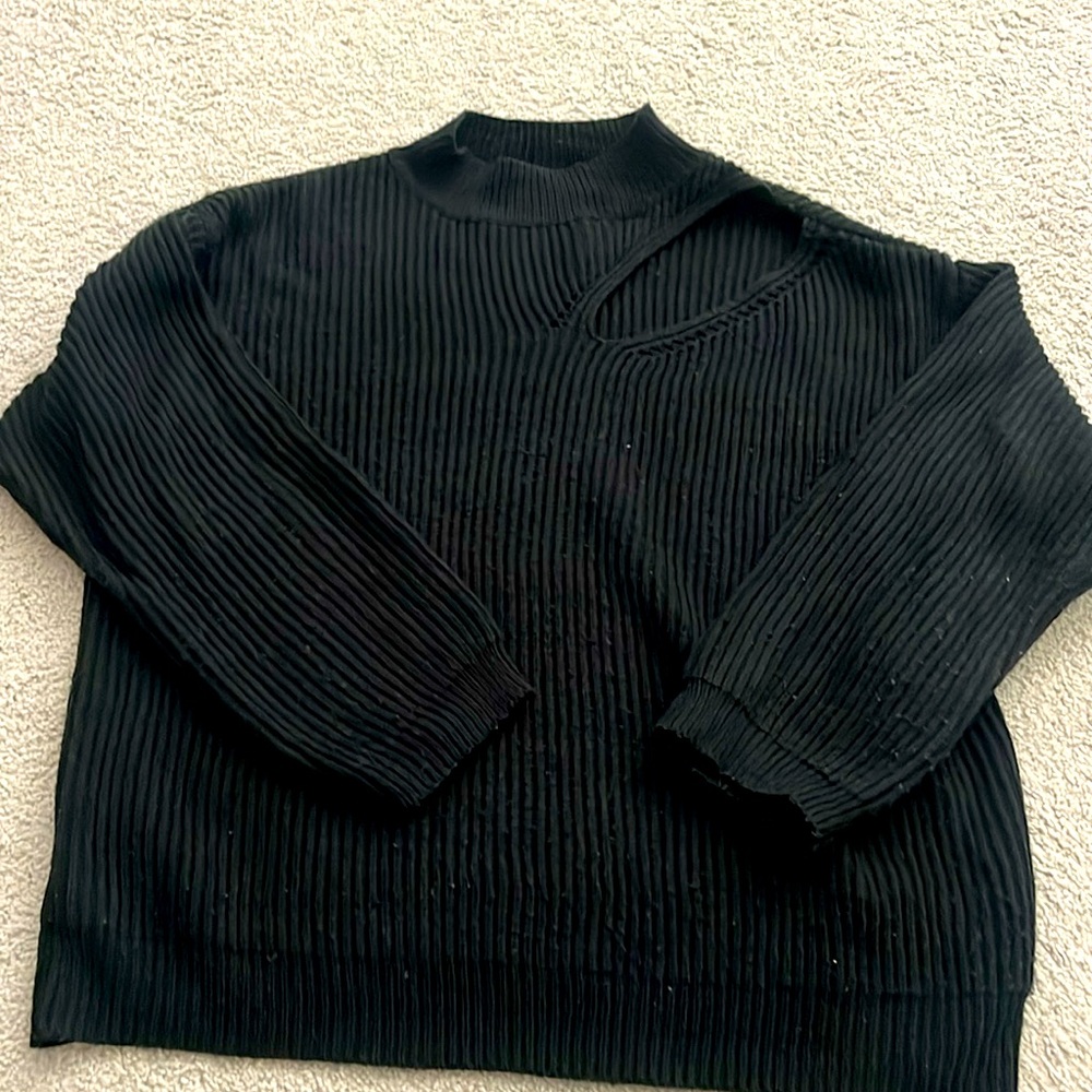 Cute with cut out at shoulder. Light piling.